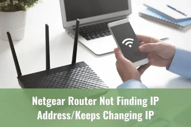 Man holding phone that is trying to find WiFi signal with a router in the background