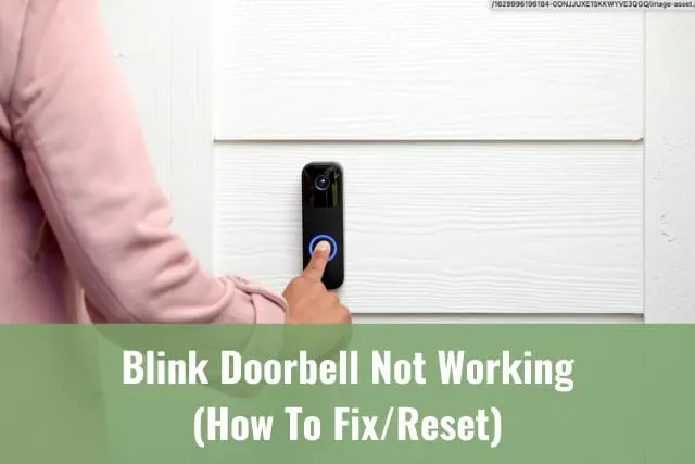 Black doorbell at the wall