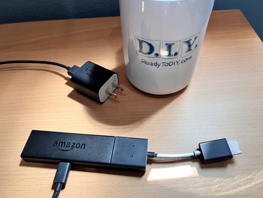 showing an amazon firestick with our one of kind readitodiy.com cup.