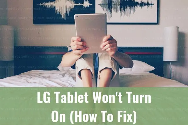 Female on bed with tablet PC in her face