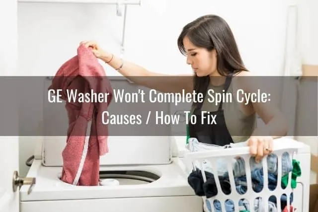 Woman pulling clothes out of top loader washing machine