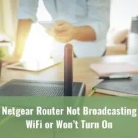 Man with a smartphone and router trying to connect to the Internet