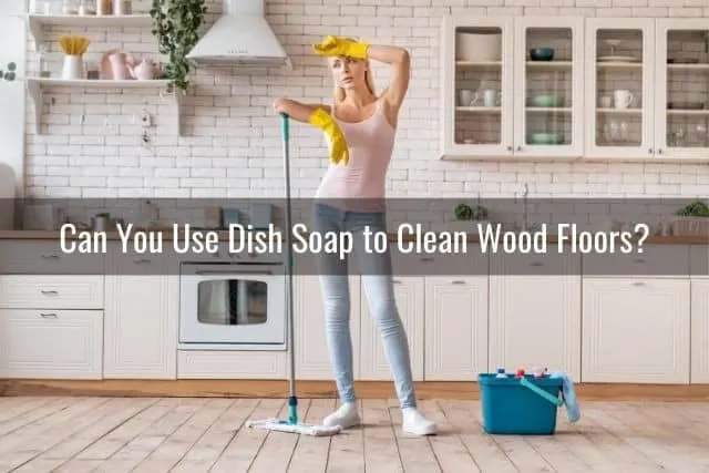 Woman tired of mopping hardwood floors