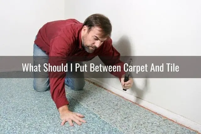 Man putting carpet padding on floor