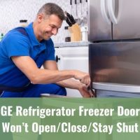Repair man fixing refrigerator freezer