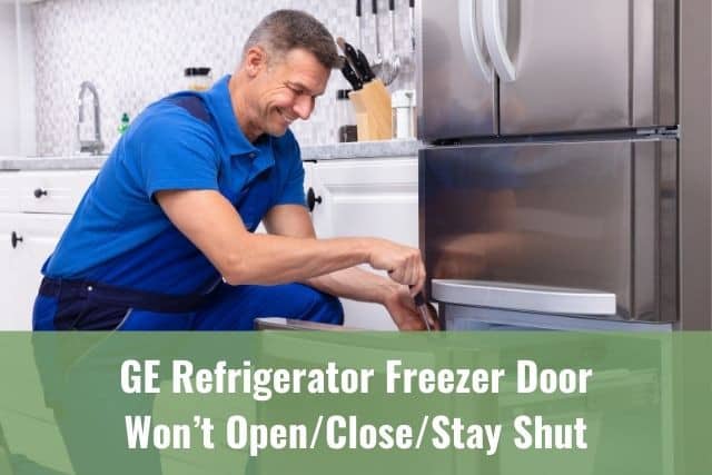 Repair man fixing refrigerator freezer