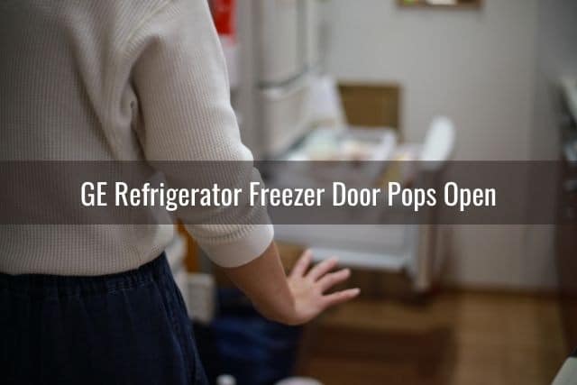 Woman in shock seeing refrigerator door open