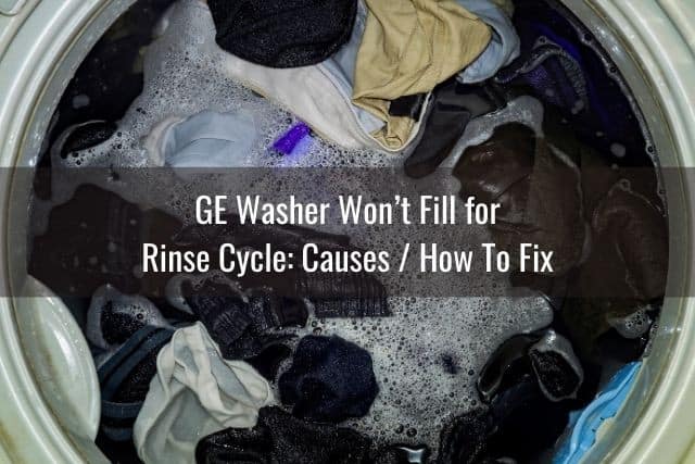 Top load washing machine full of clothes in rinse cycle