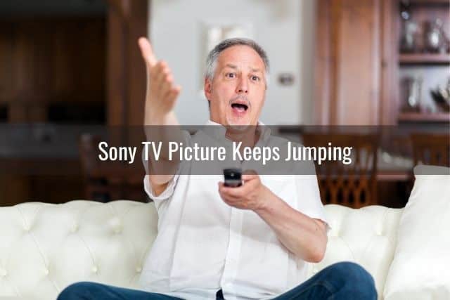 Annoyed man holding remote and yelling at TV