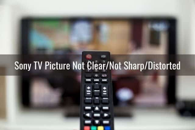 TV remote with blurry background of TV screen