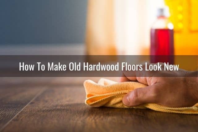 Cleaning hardwood floor with towel and cleaner