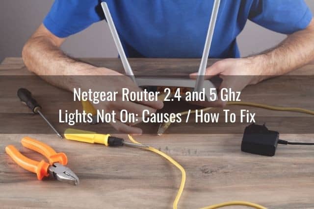 Man using tools to fix WiFi router