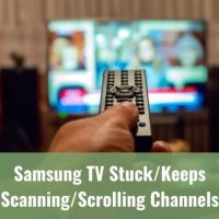 Hand holding TV remote scrolling through channels