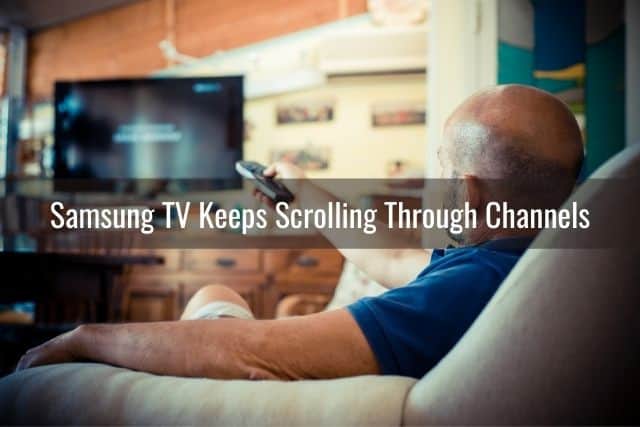 An old man watching TV with remote in hand