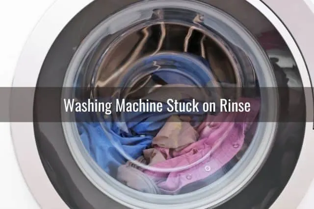 A view through a glass door of a washing machine in the spin cycle