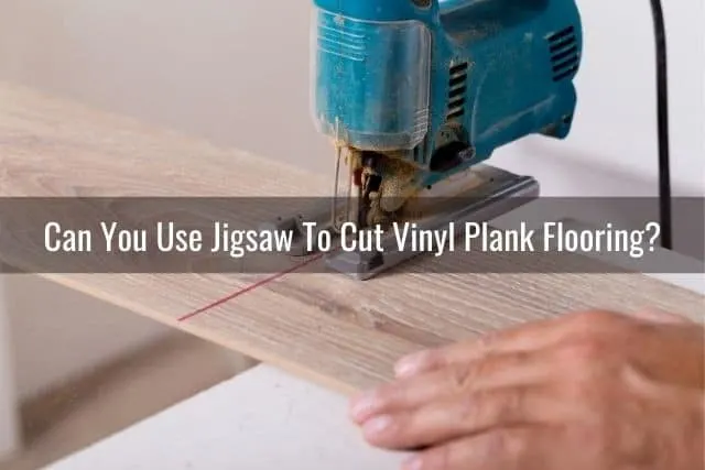 Jigsaw cutting a piece of vinyl plank flooring