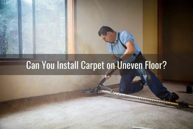 Male installing carpet flooring