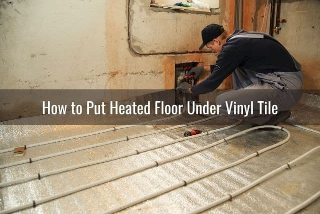 Man installing heated flooring