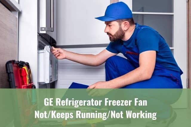 Refrigerator repairman examining freezer