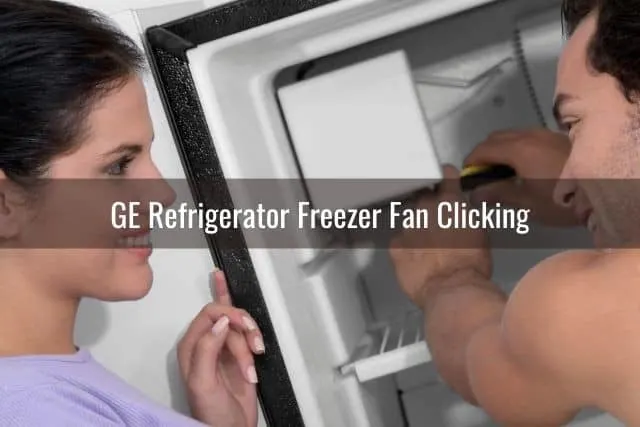 Repairman fixing fridge freezer