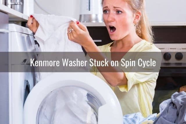 Shocked woman looking at clothes pulled out from washer