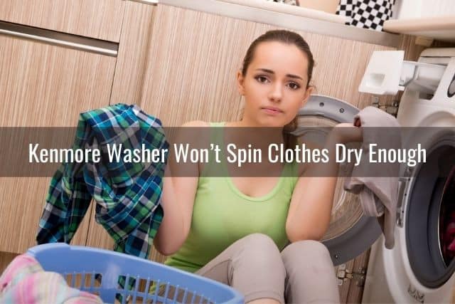Frustrated female with clothes pulled out from washer