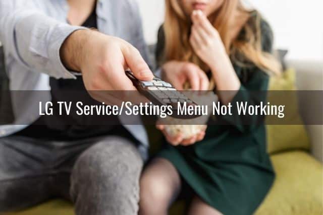 Male hand holding and pointing TV remote