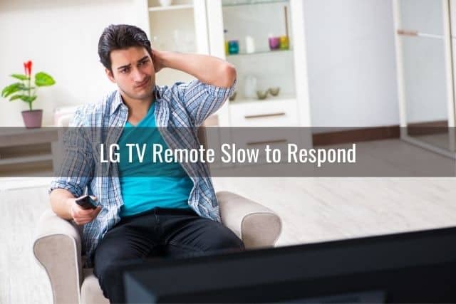 Confused male holding a TV remote and staring at screen