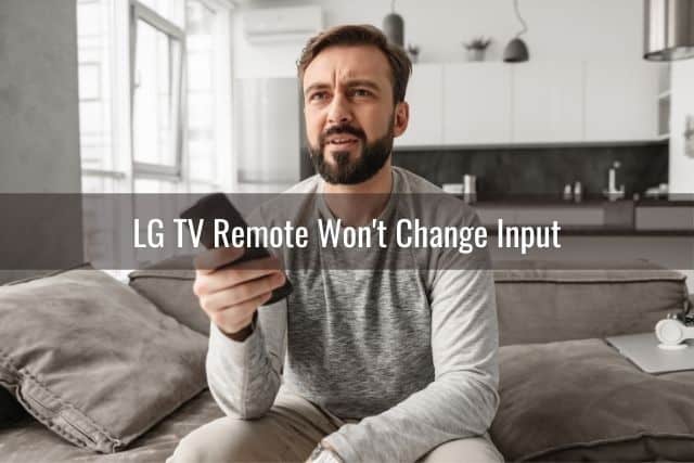 Confused man holding TV remote and watching TV