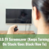 Woman pointing remote at TV