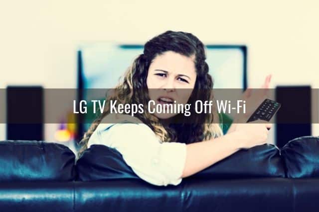 Annoyed female sitting on couch upset TV is not working