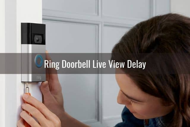 Person installing video camera doorbell