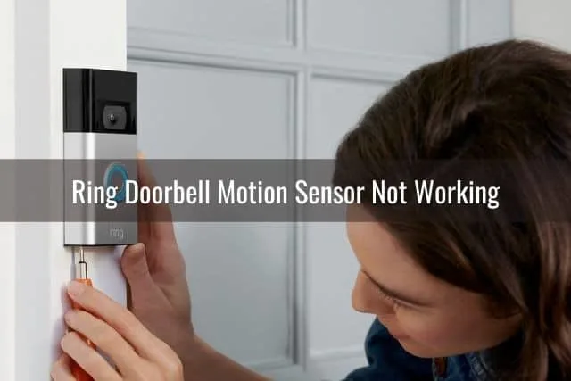 Person installing a video security doorbell camera