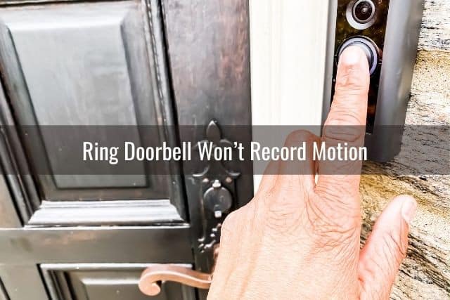 Finger pressing video camera doorbell