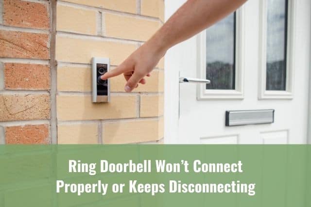 Finger pressing on video camera doorbell