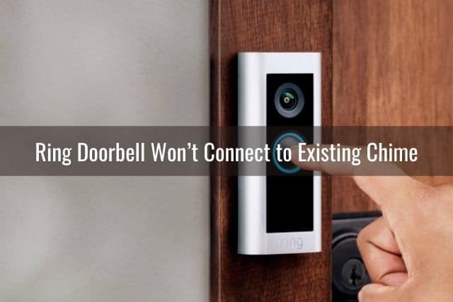 Finger pressing video camera doorbell button