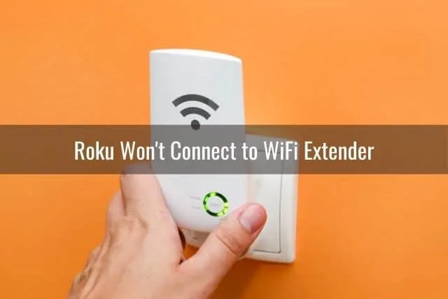 Hand plugging in WiFi extender