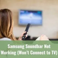 Woman sitting on a sofa watching TV