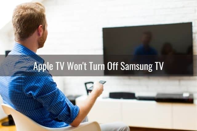 Man sitting in front of TV that won't turn on