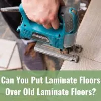 Laminate floor plank being cut by a saw