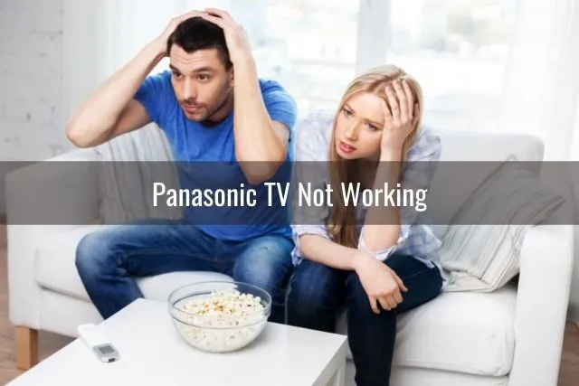 Stressed couple watching TV