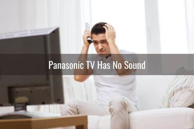 Frustrated male troubleshooting TV