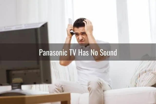 Frustrated male troubleshooting TV