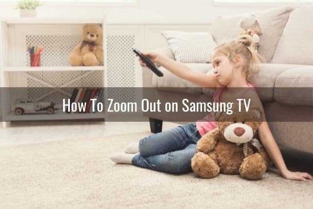 Young female child changing TV channel with remote