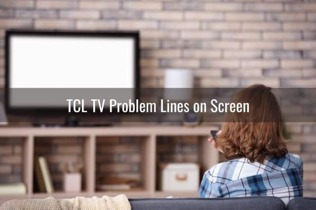 Female using remote to troubleshoot TV that has a white screen
