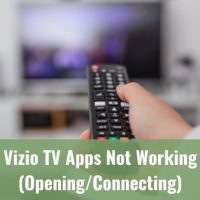 Remote being used to changed channels on a TV