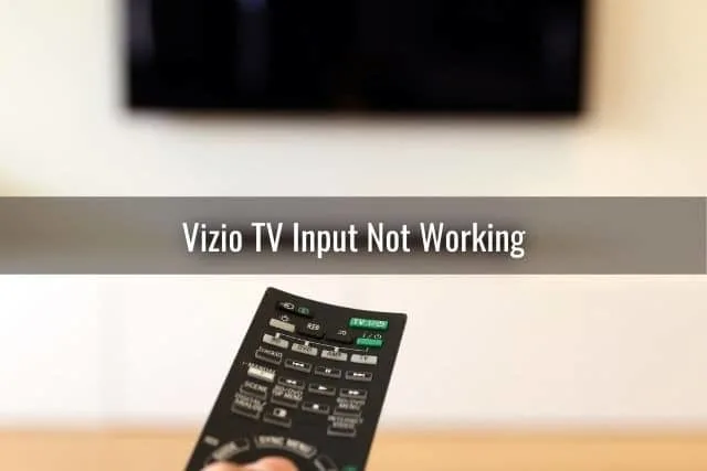 TV remote pointing to wall mounted screen