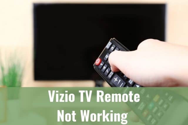 Hand holding TV remote turning TV off