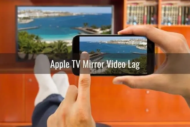 Finger using phone mirroring to TV