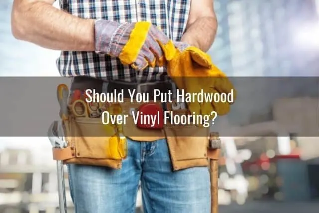 Handyman putting work gloves on
